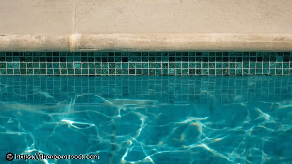 Modern swimming pool coping and tile ideas with large-format porcelain coping and dark interior tile in a contemporary backyard