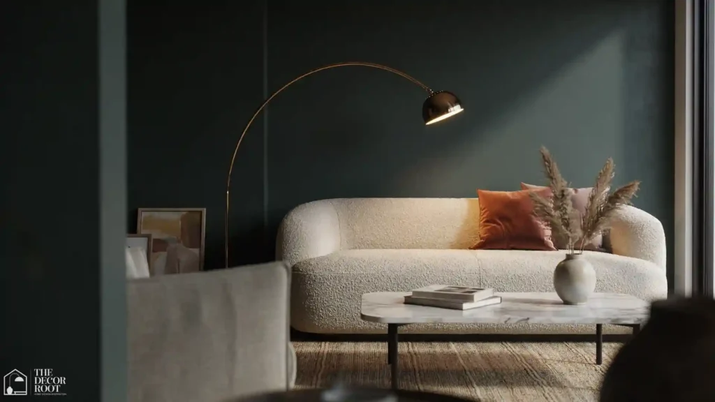 Luxury living room ideas with a dark charcoal accent wall, cream boucle sofa, gold floor lamp, and layered textiles