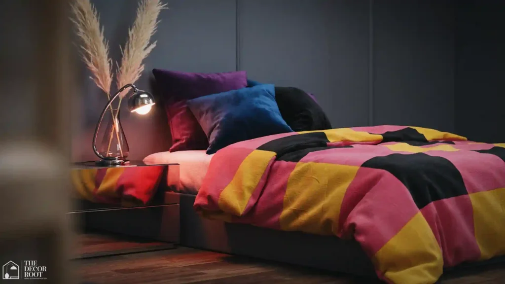 80s bedroom design ideas featuring layered geometric bedding in hot pink and electric blue on a platform bed with chrome accents